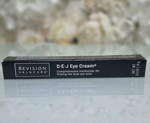 Revision Skincare D·E·J eye cream black rectangular box with white text, firming moisturizer for the eye area packaging.