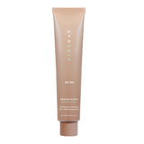 Tinted facial sunscreen tube, Airyday Bronze Glow Dreamscreen, in warm bronze-beige packaging with white lettering and SPF 50+ label.
