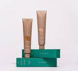Airyday Bronze Glow Dreamscreen SPF50+ sunscreen in bronze-beige tubes, with teal cartons and a sun-kissed glow design.