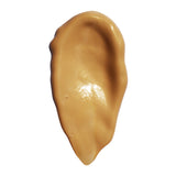 Airyday Golden Glow Dreamscreen SPF50+ facial sunscreen in a sheer golden-brown shade, with a smooth, glossy cream texture.