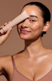 Facial sunscreen, Airyday Golden Glow Dreamscreen SPF50+, in a beige squeeze tube with a sheer golden cream tint.