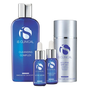 iS Clinical Pure Clarity skincare set featuring blue and silver bottles including Cleansing Complex, Active Serum, Hydra-Cool Serum, and Eclipse SPF 50+