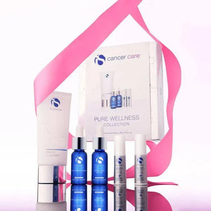 iS Clinical Pure Wellness Collection with white cream cleanser tube, blue and white serum bottles, oncology care packaging, and pink ribbon.