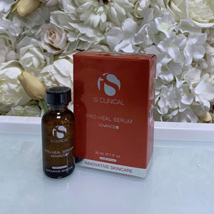 iS Clinical Pro-Heal Serum in amber glass bottle with black cap next to red and white box packaging with silver logo and text