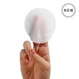 NEOVA 5-Second Daily Peel exfoliating pad, white textured round fabric held between fingers with a pink center mark.