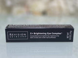 Revision Skincare C+ Brightening Eye Complex black rectangular box with white text, vitamin C treatment for dark circles and puffiness