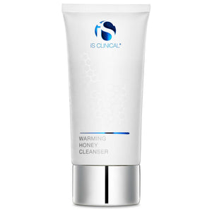 Tube of iS Clinical Warming Honey Cleanser in white with blue logo and silver cap, featuring subtle honeycomb pattern on the front.
